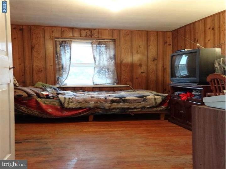 1904 Ridge Road Sellersville, PA 18960 - Photo 14 of 24 a room with a bed and a flat screen tv