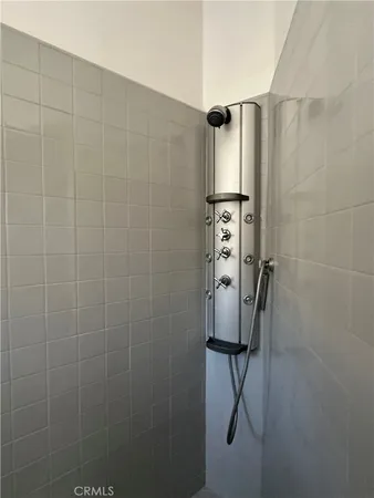 a bathroom with a shower and a shower