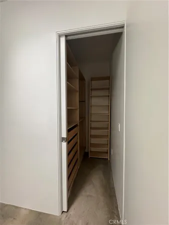 a view of walk in closet with stairs