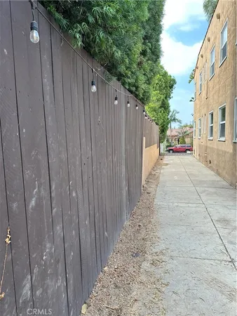 a view of a wooden door with a wooden fence
