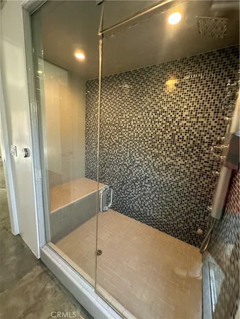 a bathroom with a bathtub and shower