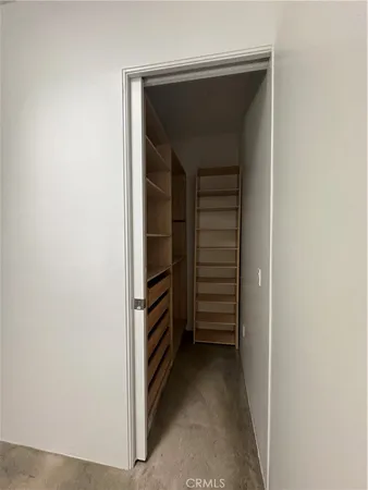 a view of walk in closet with stairs