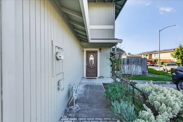 a front view of a house with a door and a mirror