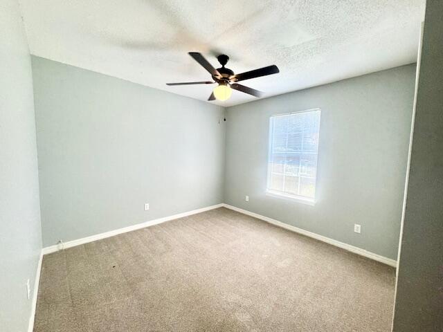 129 Wright Circle Niceville, FL 32578 - Photo 11 of 17 an empty room with a window and a fan