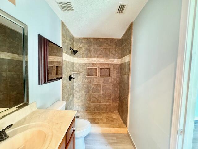 129 Wright Circle Niceville, FL 32578 - Photo 12 of 17 a bathroom with a granite countertop sink a mirror and shower