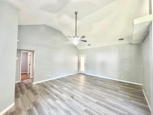 129 Wright Circle Niceville, FL 32578 - Photo 4 of 17 a view of a room with wooden floor and ceiling fan