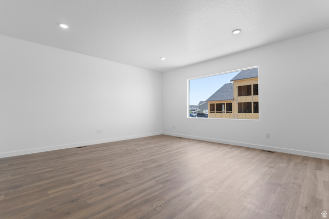 1355 West 2350 South, Unit 11 Perry, UT 84302 - Photo 13 of 39 Spacious room featuring light wood-finish flooring, recessed lighting, and a large window