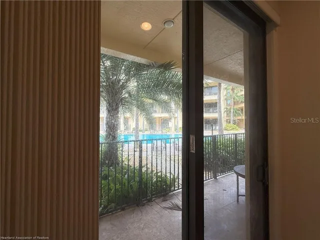a view of a porch with a floor to ceiling window