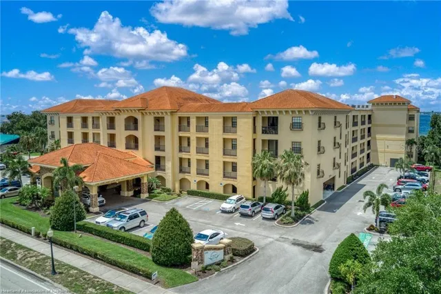a view of a lake with a table and chairs