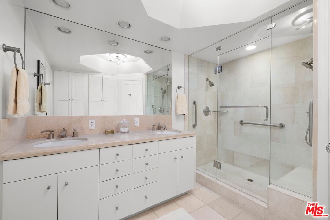 1 Northstar Street, Unit PH1 Marina del Rey, CA 90292 - Photo 11 of 18 a bathroom with a double vanity sink mirror and shower