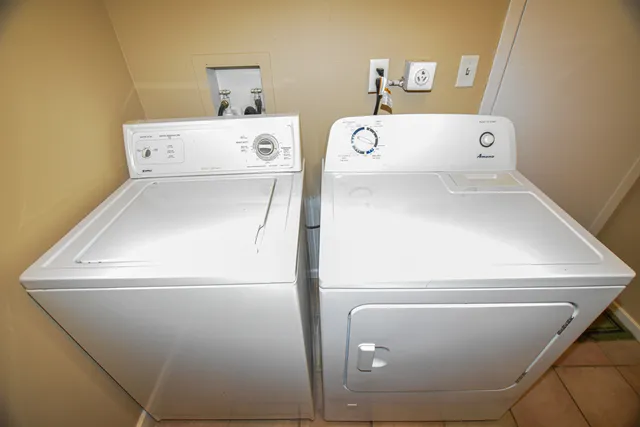 a utility room with dryer and washer