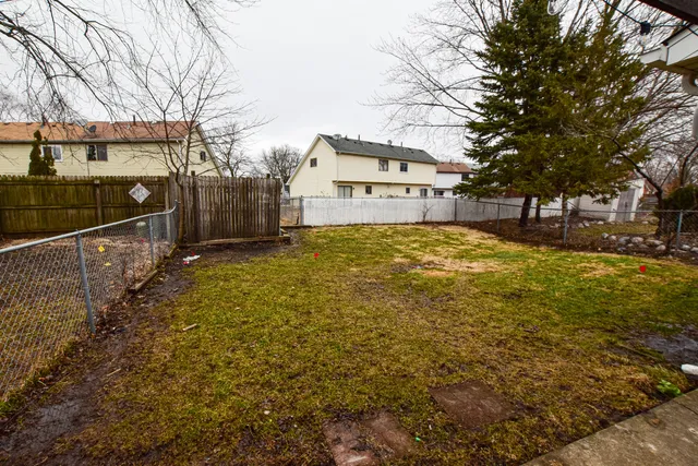 a large house with a large tree in front of it