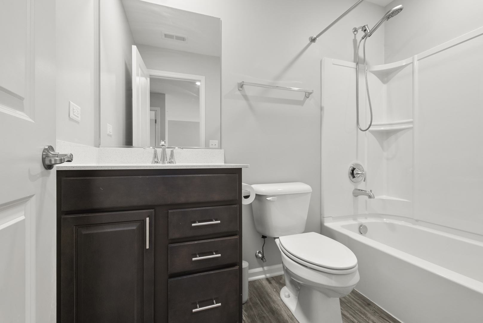 2045 Stuttle Road Batavia, IL 60510 - Photo 14 of 18 a bathroom with a sink a toilet a mirror and shower