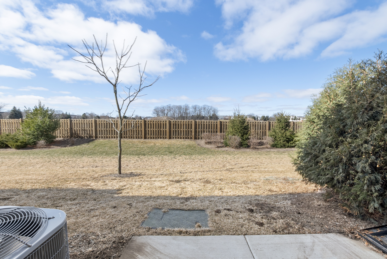 2045 Stuttle Road Batavia, IL 60510 - Photo 16 of 18 a backyard of apartments with large trees
