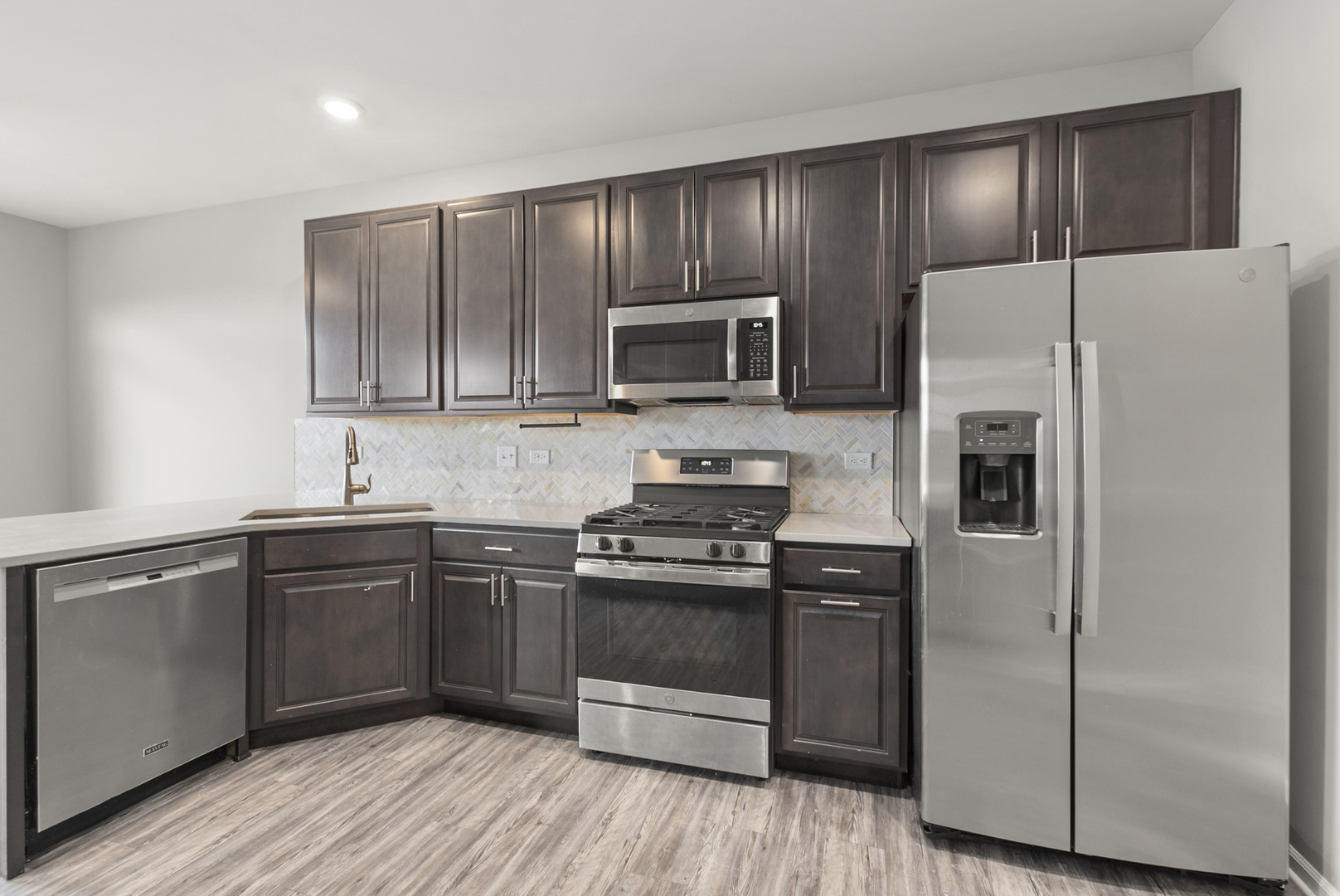 2045 Stuttle Road Batavia, IL 60510 - Photo 7 of 18 a kitchen with a sink stove and refrigerator