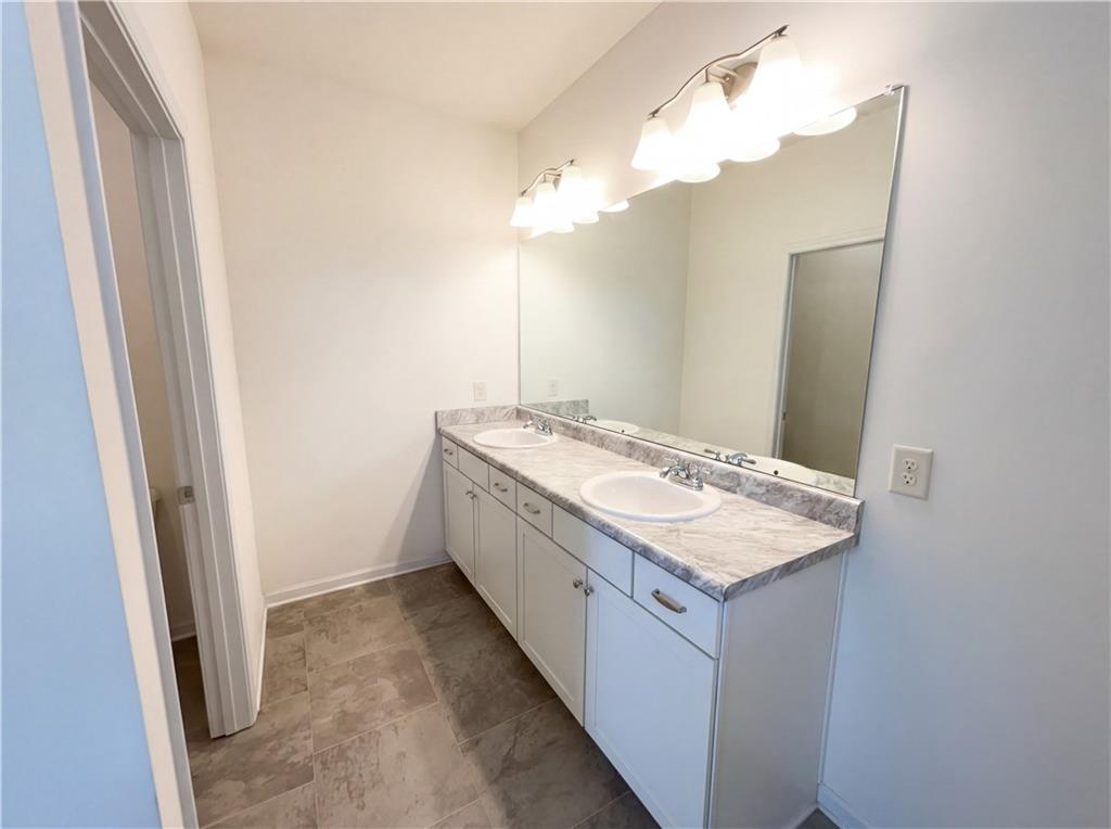 2682 North Broad Street Extension Northeast Rome, GA 30161 - Photo 15 of 23 a bathroom with a sink and a mirror