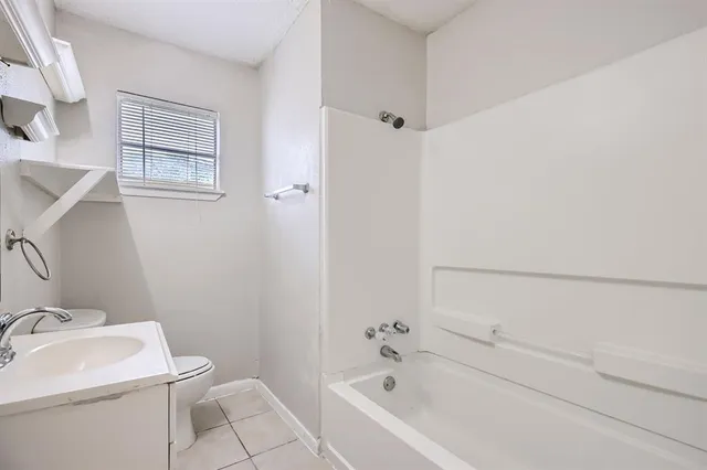 a bathroom with a sink and toilet