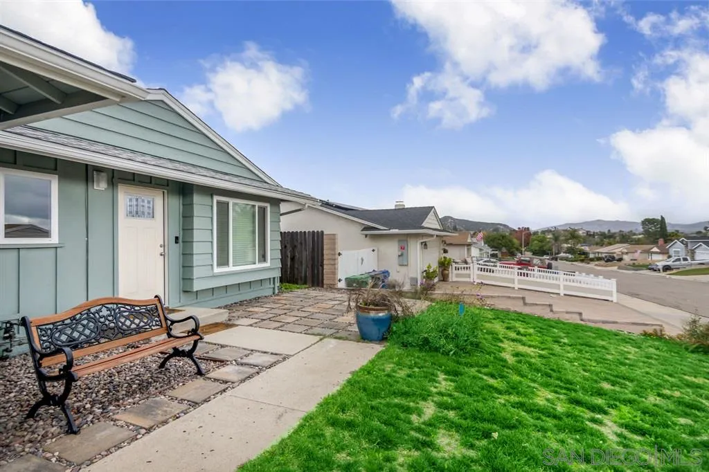 10116 Pinewood View Santee, CA 92071 - Photo 3 of 24 a view of a house with backyard sitting area and garden