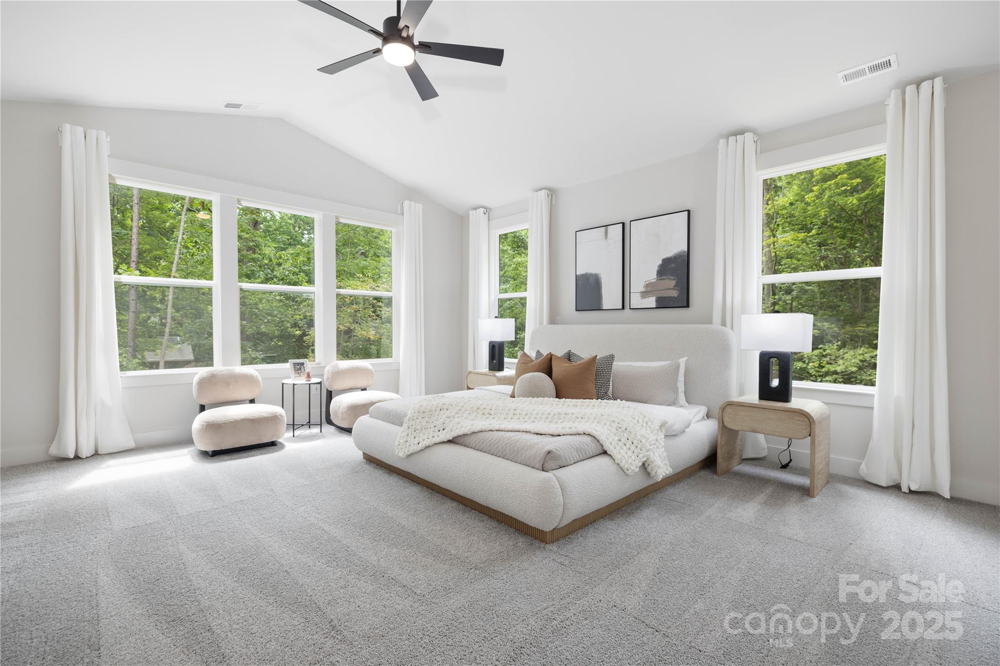 8937 Penstemons Drive Charlotte, NC 28215 - Photo 15 of 31 a spacious bedroom with a bed and a large window