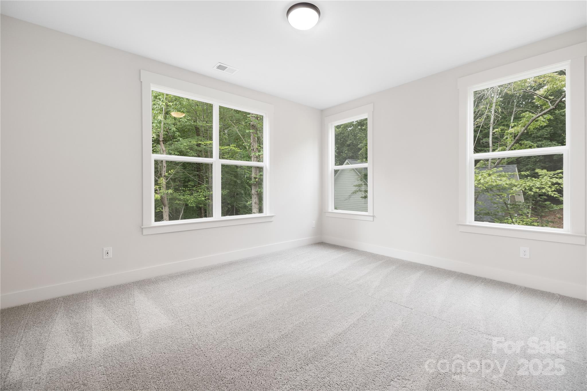 8937 Penstemons Drive Charlotte, NC 28215 - Photo 19 of 31 an empty room with a window