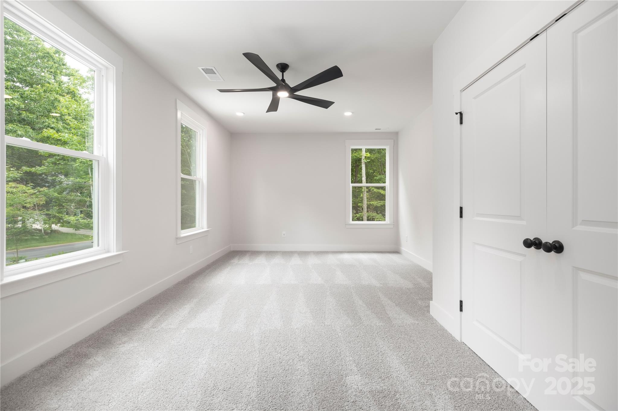8937 Penstemons Drive Charlotte, NC 28215 - Photo 23 of 31 a view of an empty room with a window