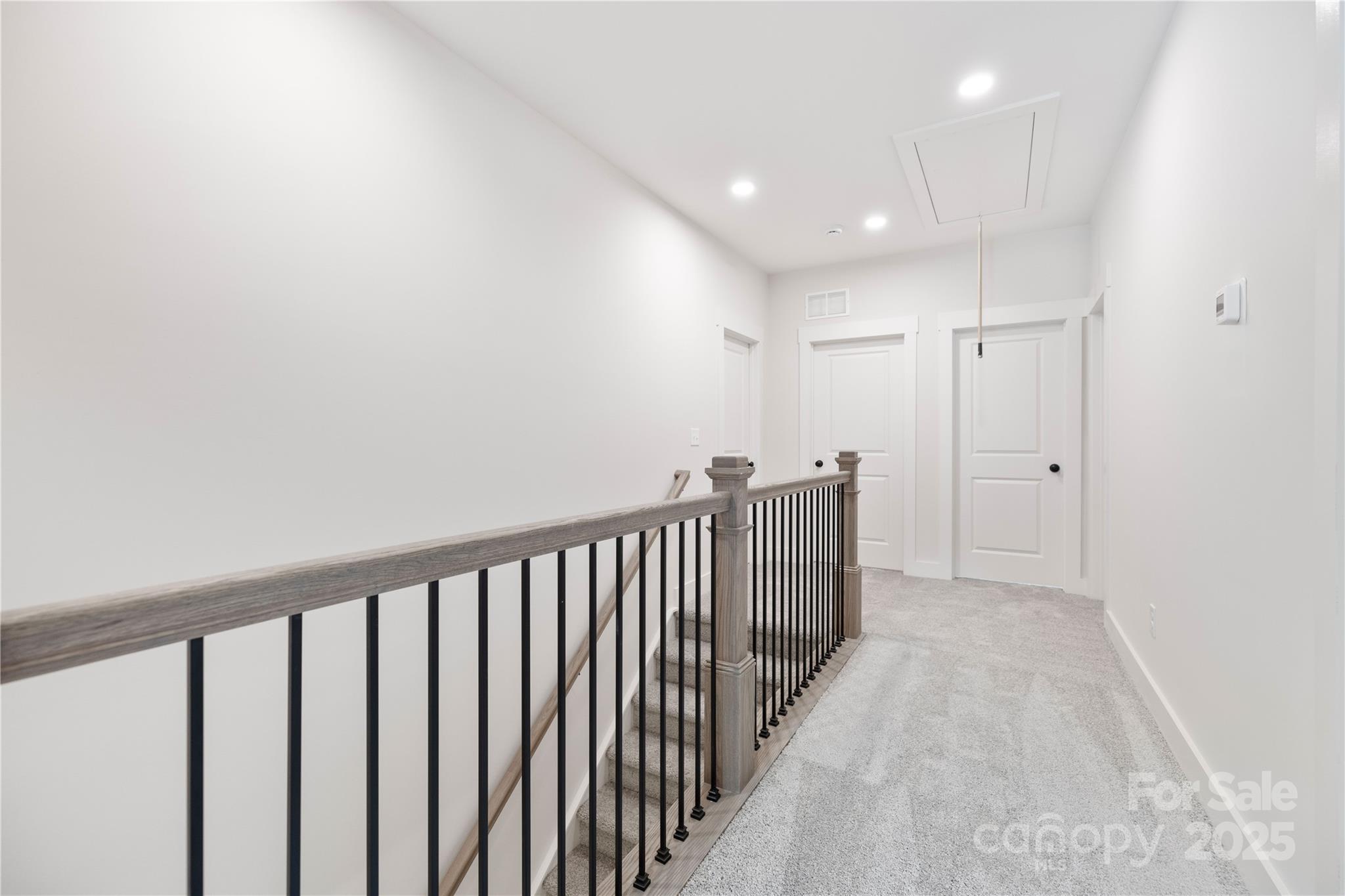 8937 Penstemons Drive Charlotte, NC 28215 - Photo 25 of 31 a view of hallway with wooden floor