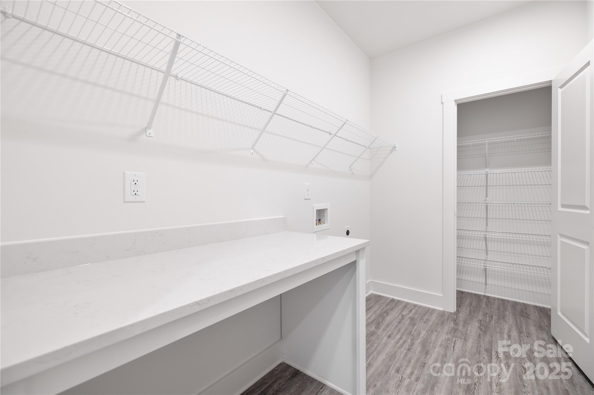 8937 Penstemons Drive Charlotte, NC 28215 - Photo 27 of 31 a room with cabinets and wooden floor