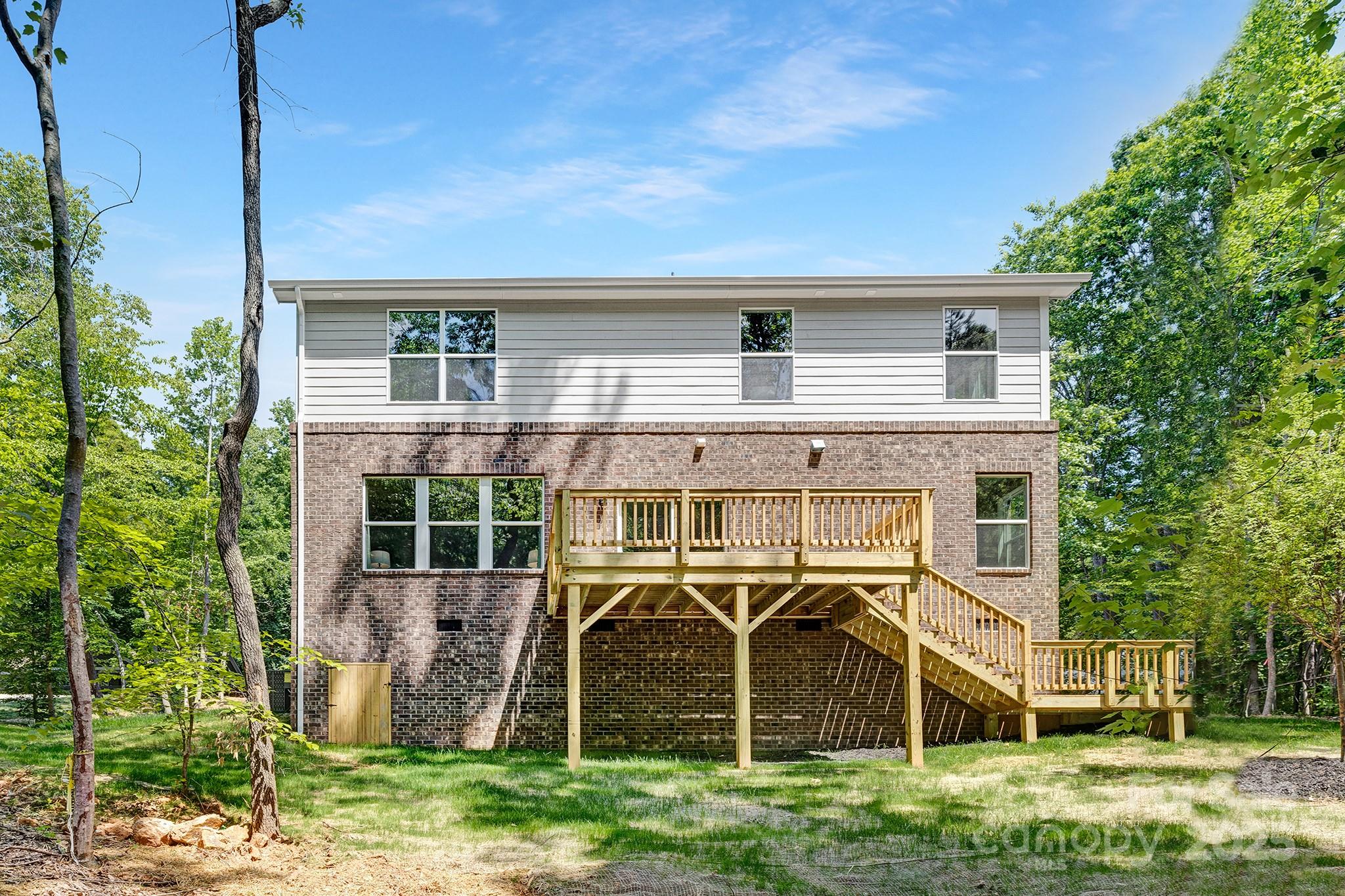 8937 Penstemons Drive Charlotte, NC 28215 - Photo 30 of 31 a view of a house with a backyard