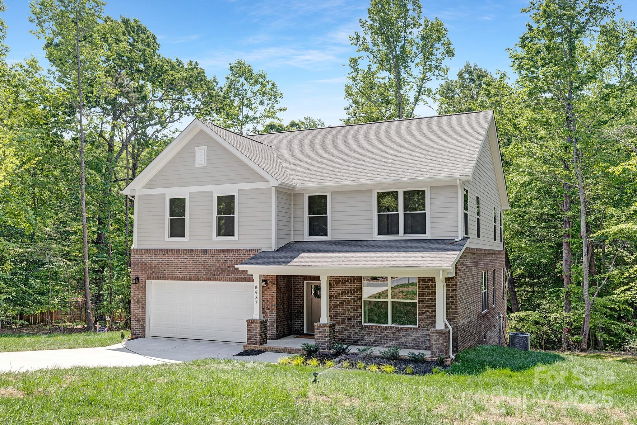 8937 Penstemons Drive Charlotte, NC 28215 - Photo 3 of 31 a view of house with a yard