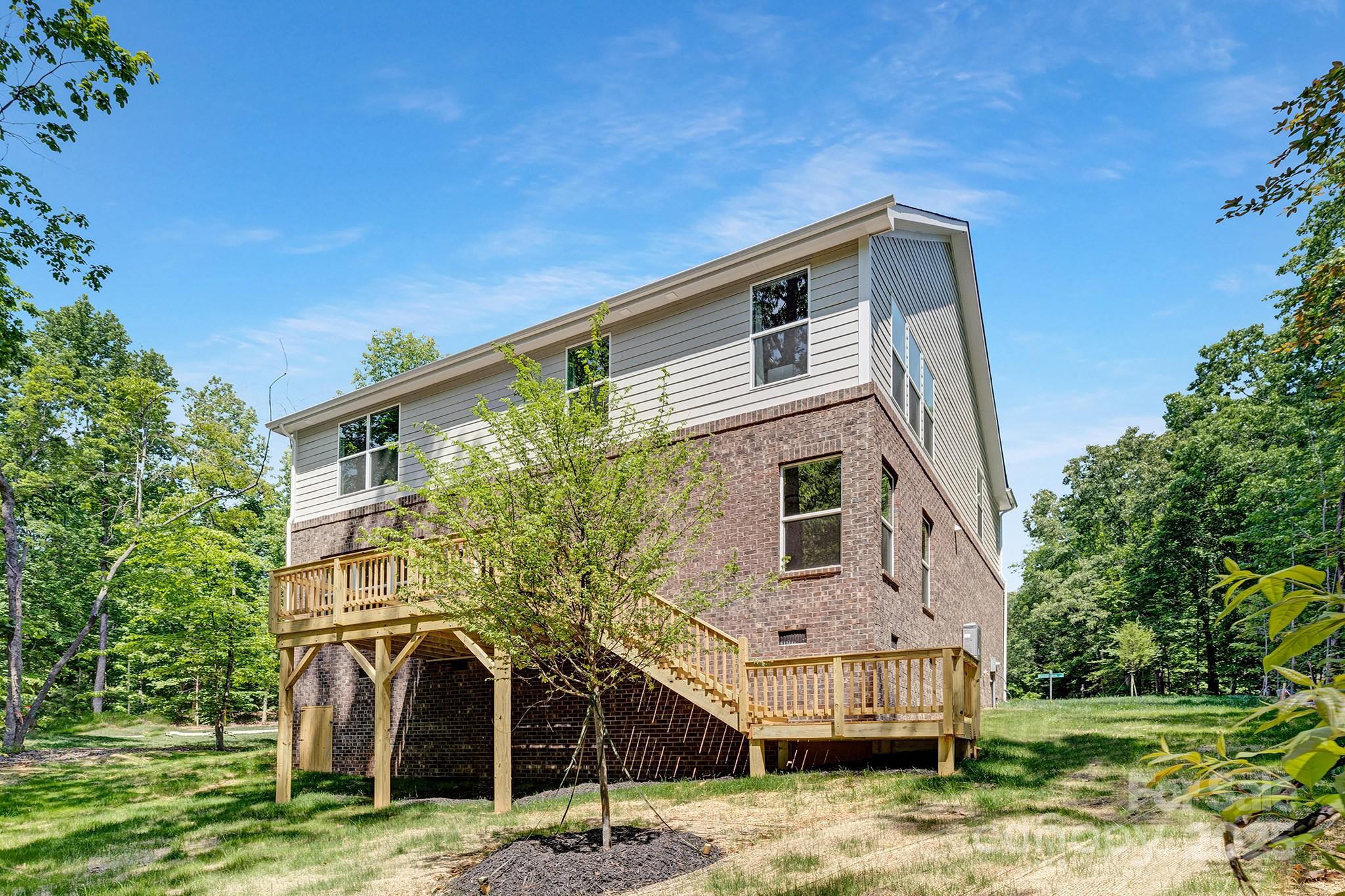 8937 Penstemons Drive Charlotte, NC 28215 - Photo 31 of 31 a front view of a house with garden