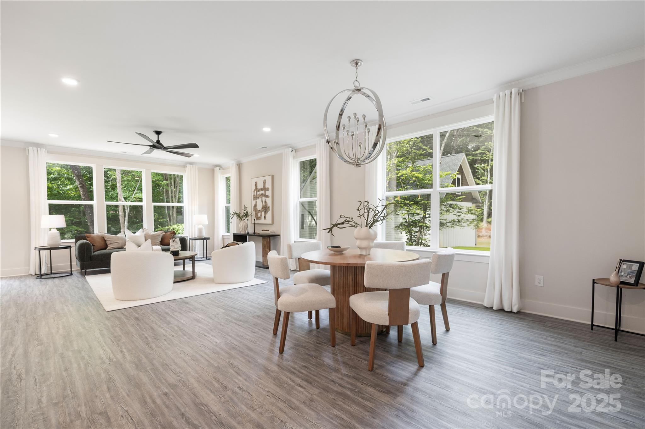 8937 Penstemons Drive Charlotte, NC 28215 - Photo 6 of 31 a view of a dining room with furniture window and wooden floor