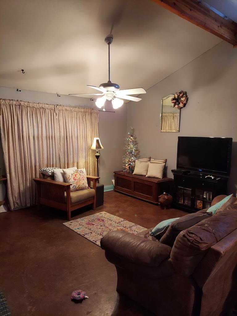1207 Loving Street Mason, TX 76856 - Photo 2 of 10 a bedroom with bed or couch and a flat screen tv