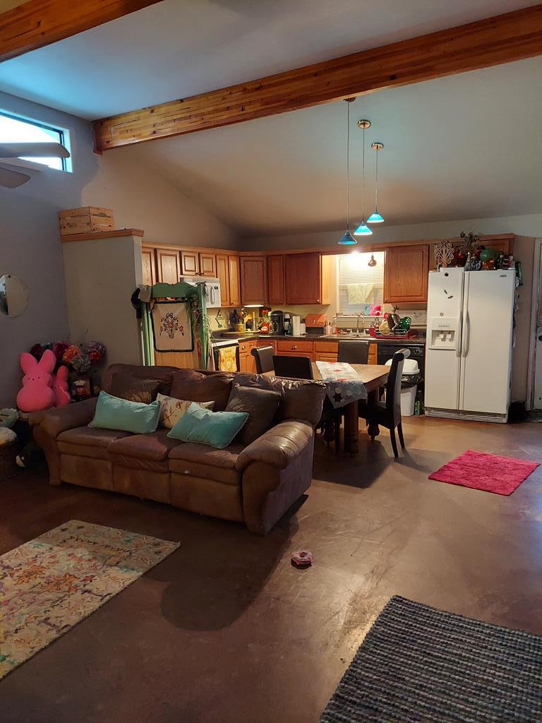 1207 Loving Street Mason, TX 76856 - Photo 3 of 10 a living room with furniture and a chandelier