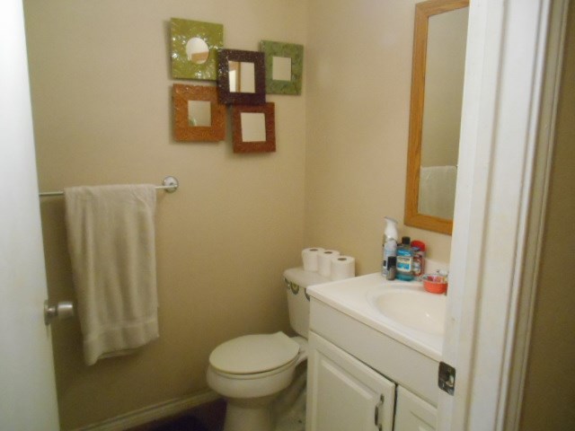 1207 Loving Street Mason, TX 76856 - Photo 9 of 10 a bathroom with a sink mirror and toilet