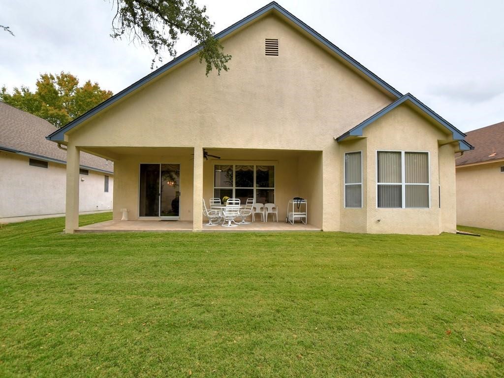 167 Whispering Wind Drive Georgetown, TX 78633 - Photo 19 of 29 The extended covered patio opens onto a very level back yard (just one small step down)