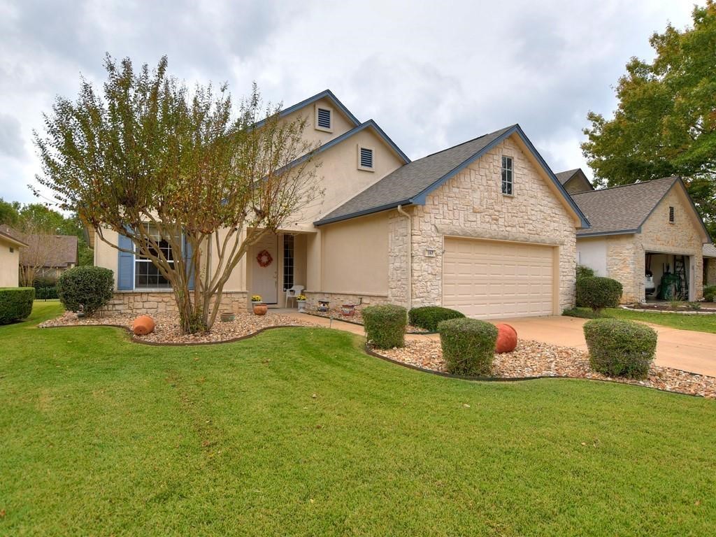 167 Whispering Wind Drive Georgetown, TX 78633 - Photo 2 of 29 Front yard with beautiful low maintenance rock beds.
