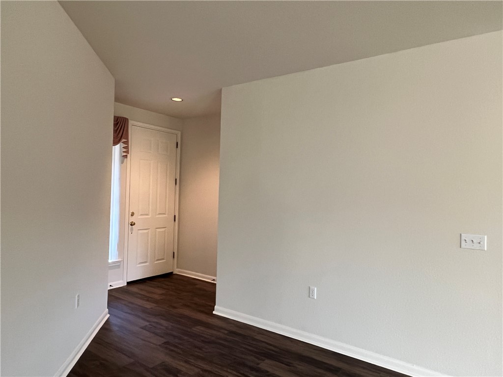 167 Whispering Wind Drive Georgetown, TX 78633 - Photo 3 of 29 8' front door - all main areas with continuous Luxury Vinyl Plank (LVP) flooring through main areas, hallways and bedrooms. Bathrooms are tile. The only carpet is in the master closet.
