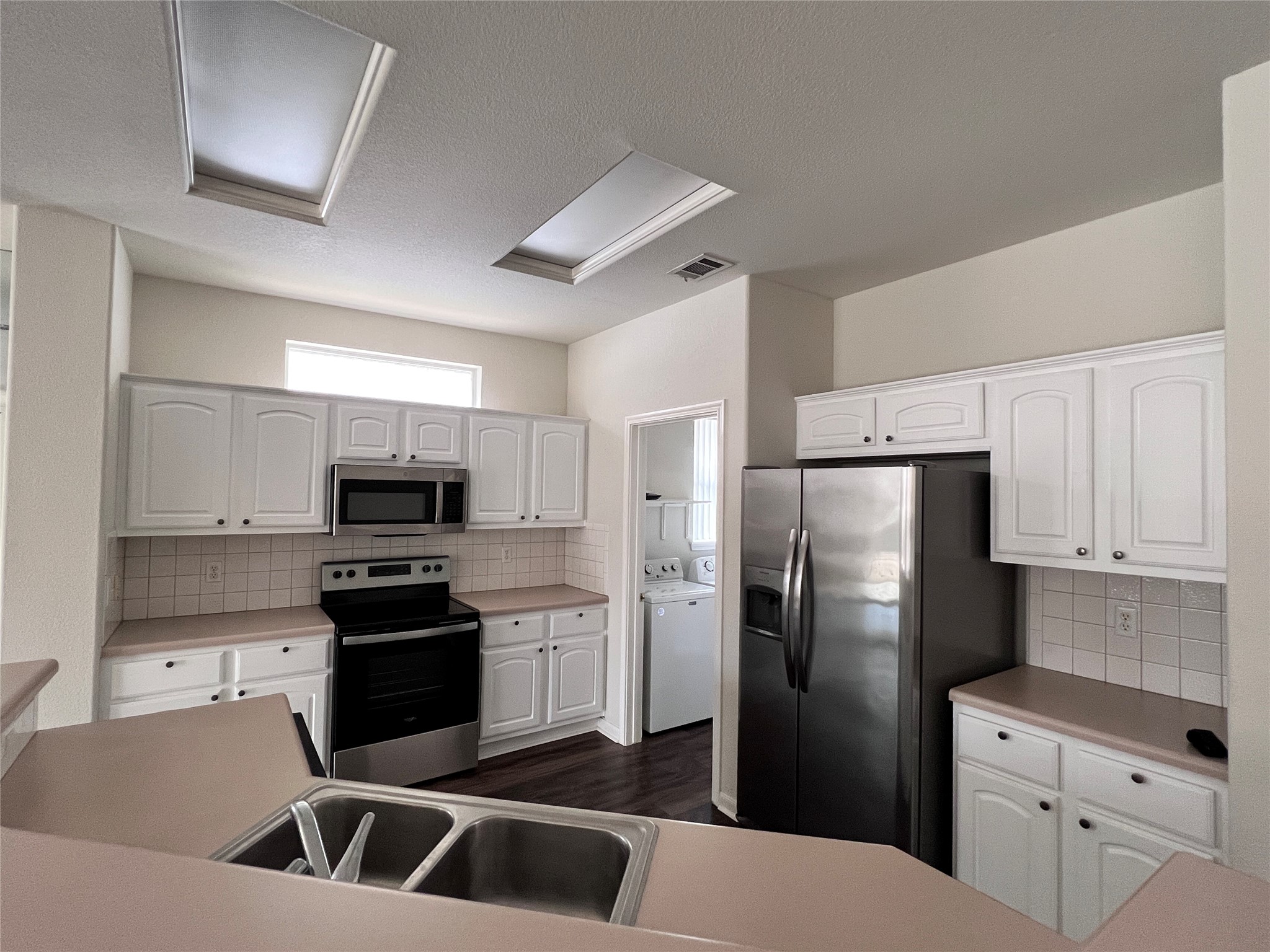 167 Whispering Wind Drive Georgetown, TX 78633 - Photo 5 of 29 New stainless steel stove and microwave