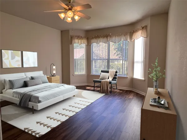 a bedroom with a bed window and a table
