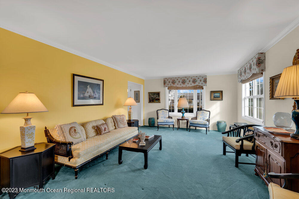 7 Howell Avenue Spring Lake, NJ 07762 - Photo 11 of 52 a living room with furniture a lamp and a window