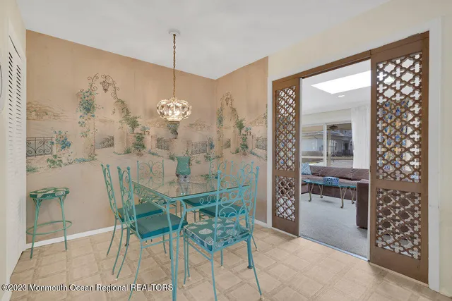 a dining room with furniture and window