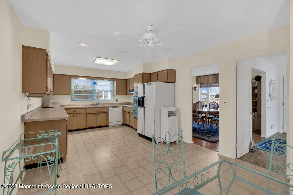 7 Howell Avenue Spring Lake, NJ 07762 - Photo 16 of 52 a kitchen with a refrigerator and a sink