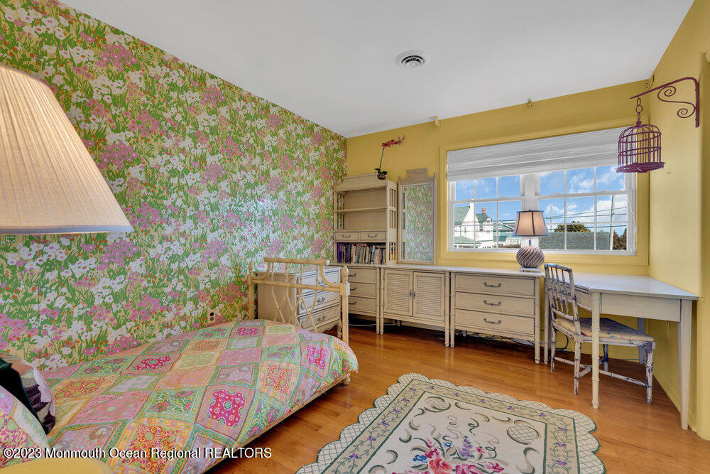 7 Howell Avenue Spring Lake, NJ 07762 - Photo 20 of 52 a bedroom with a bed and a table