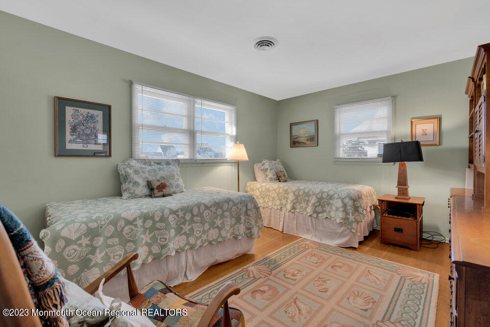 7 Howell Avenue Spring Lake, NJ 07762 - Photo 22 of 52 a bedroom with a bed and a night stand