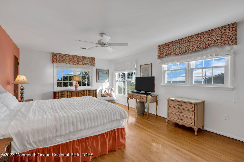 7 Howell Avenue Spring Lake, NJ 07762 - Photo 24 of 52 a bedroom with a bed and a flat screen tv