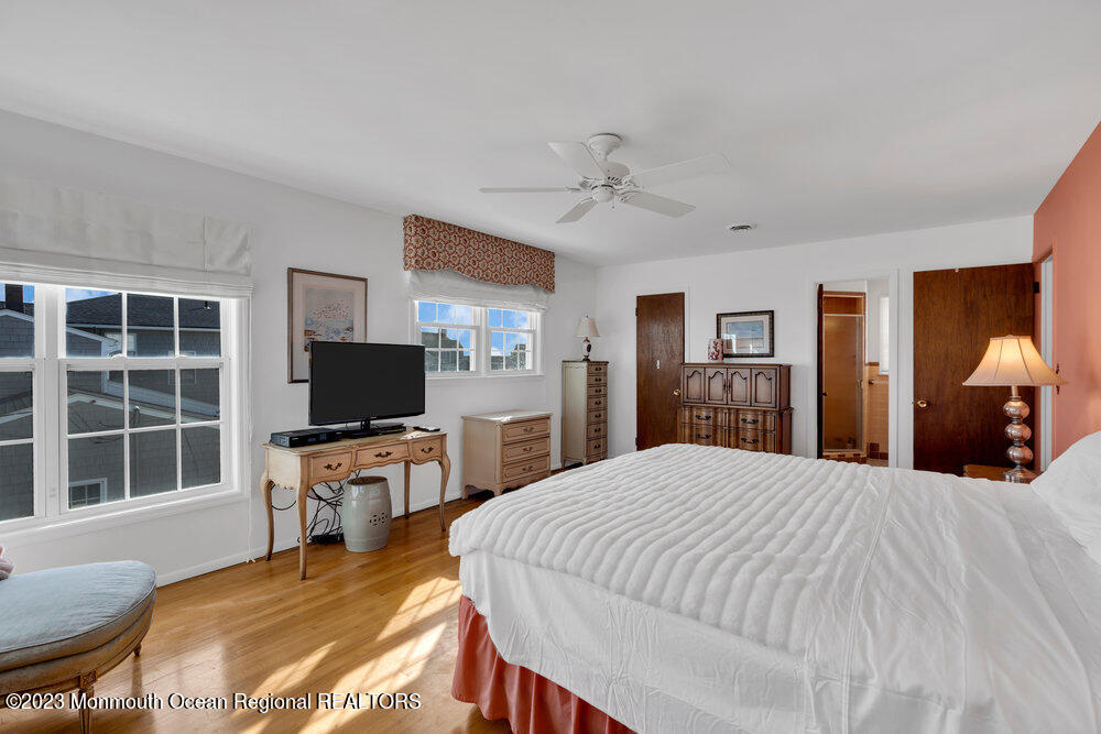 7 Howell Avenue Spring Lake, NJ 07762 - Photo 27 of 52 a bedroom with a bed and a flat screen tv