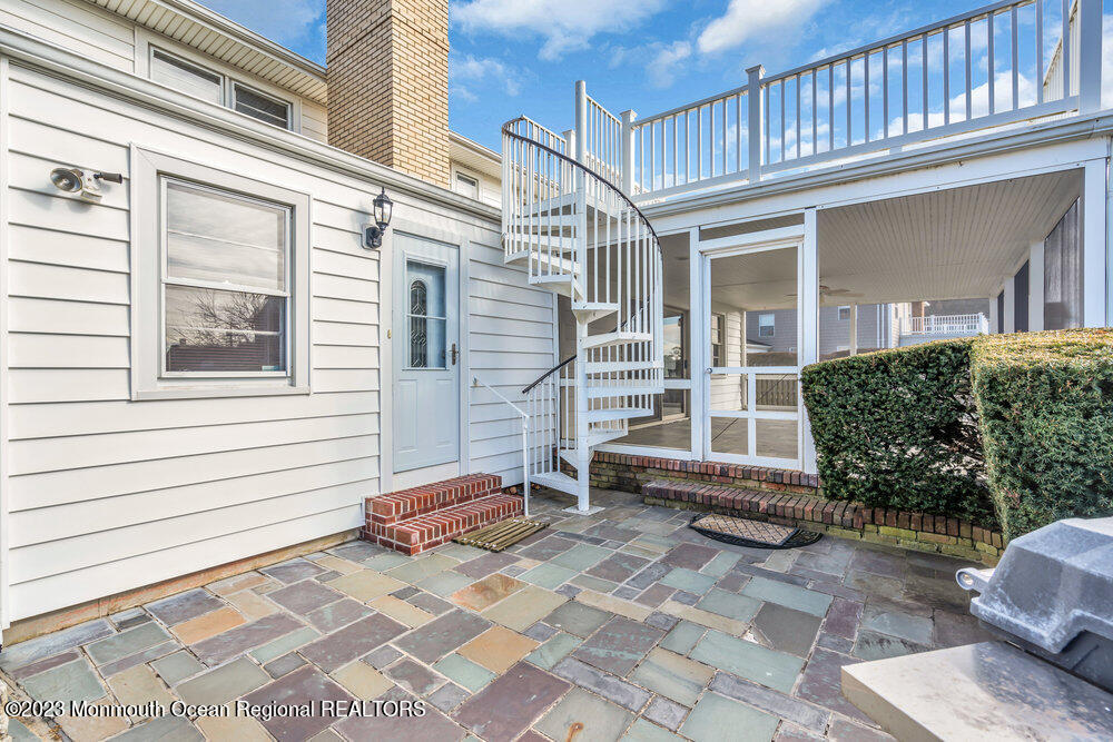 7 Howell Avenue Spring Lake, NJ 07762 - Photo 29 of 52 a view of a patio with a chairs and table in the patio