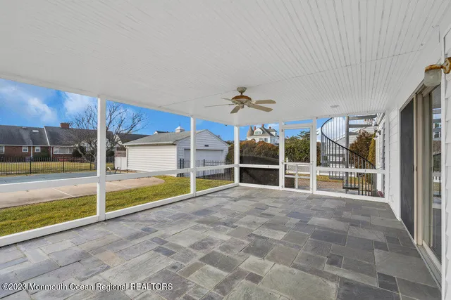 a view of empty room with a large window
