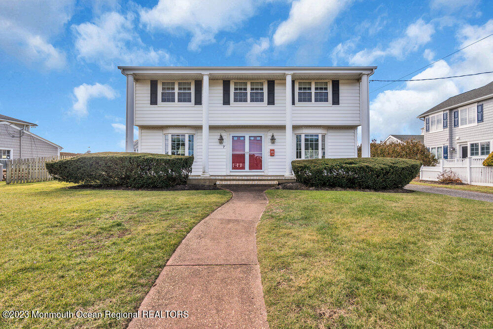 7 Howell Avenue Spring Lake, NJ 07762 - Photo 41 of 52 a front view of a house with a garden