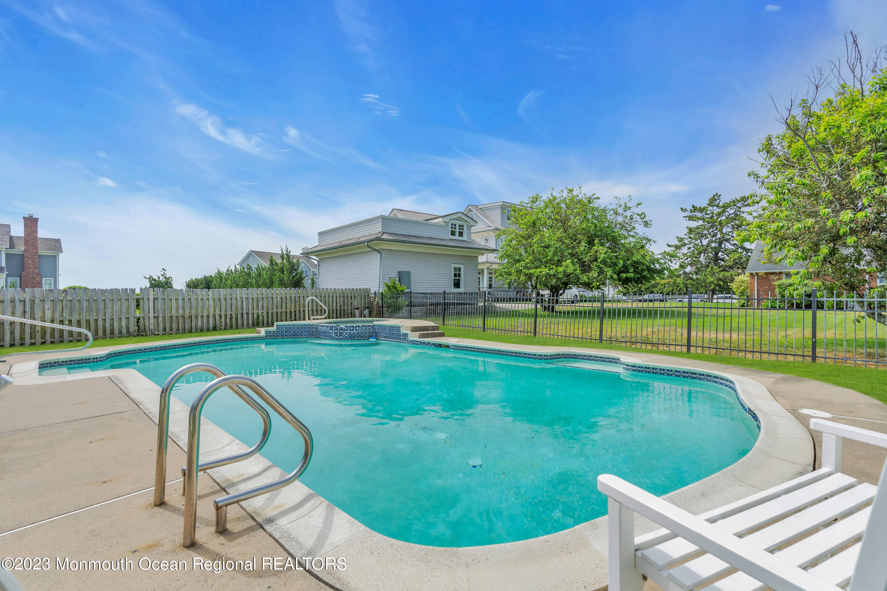 7 Howell Avenue Spring Lake, NJ 07762 - Photo 45 of 52 a view of a swimming pool with a patio